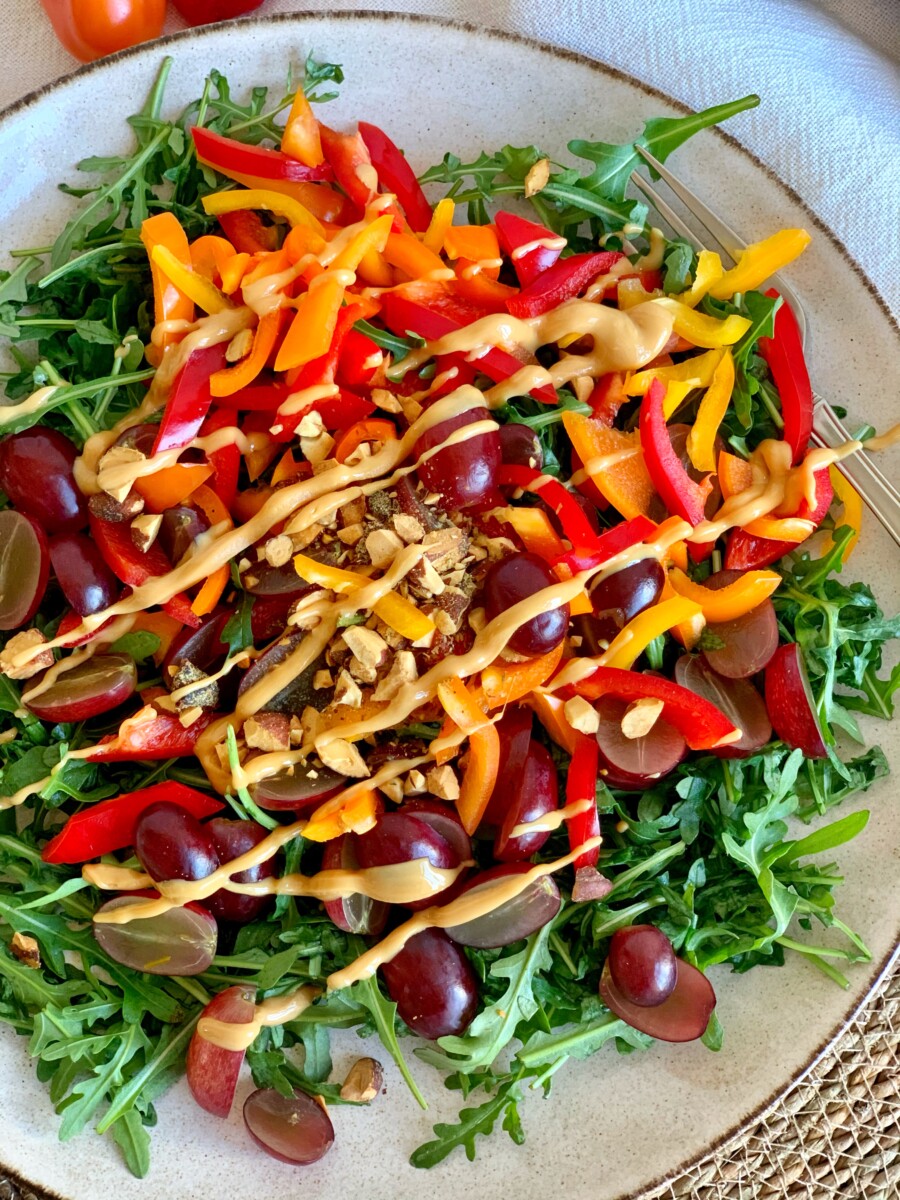 Easy Arugula salad with grapes and peanut butter dressing (vegan